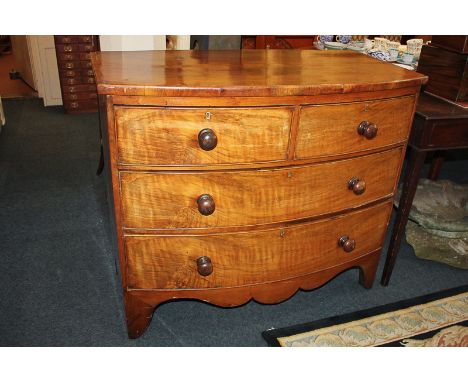 A walnut bowfront chest of two short over two long drawers, on bracket feet, 104cm (a/f)