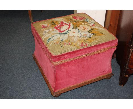 A Victorian Ottoman stool with floral tapestry top and concave side, 55cm