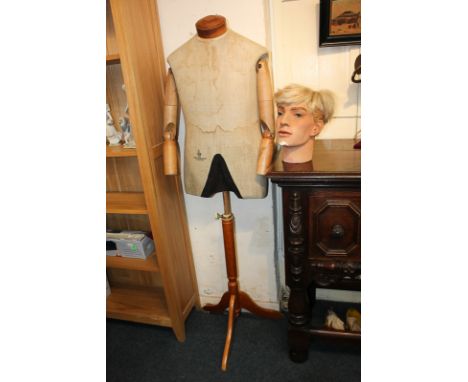 A 1960's Obermaier 'military uniform' mannequin, with removable neck cap and articulated wooden arms, on an adjustable tripod