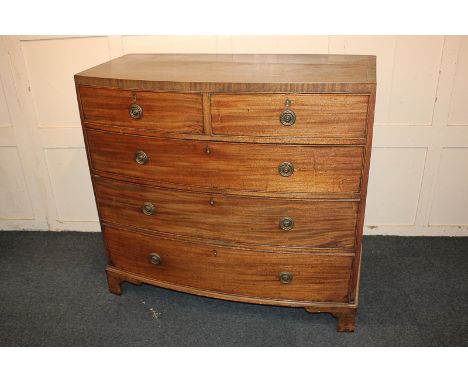 A 19th century mahogany crossbanded top bowfront chest of two short over three long drawers, on bracket feet, 107cm