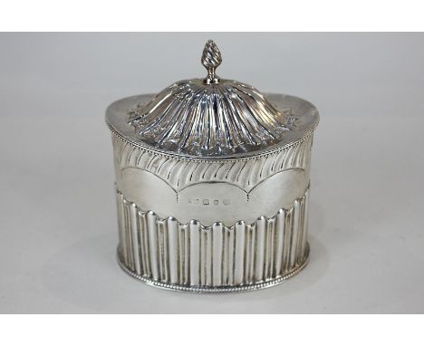 A Victorian silver tea caddy, maker Nathan & Hayes, Birmingham 1891, with half reeded and fluted oval form, 7oz