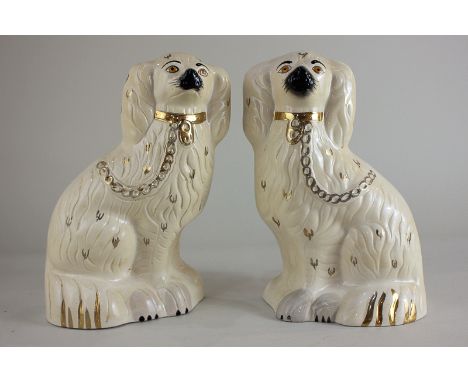 A pair of Beswick models of Old English dogs in white and gold, from the Mantelpiece Dogs series, 22.5cm