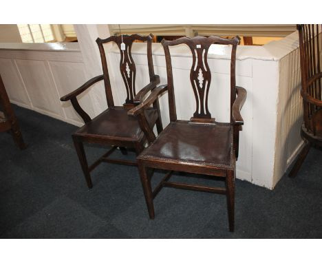 A pair of Chippendale style carver dining chairs with pierced splats, on square tapered legs