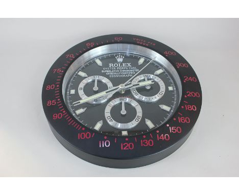A Rolex advertising wall clock with black and red surround, the dial marked 'Rolex Oyster Perpetual Superlative Chronometer, 