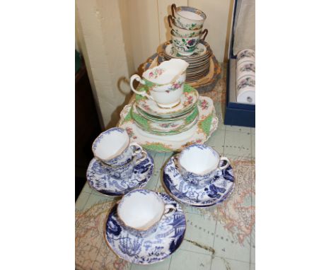 A set of four Royal Crown Derby porcelain teacups and saucers, in blue Chinese pattern, a part set of Paragon Rockingham patt