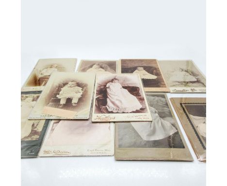 Featuring thicker cardstock photo material or plastic protective layer covering on all photos. Depicts individual young child