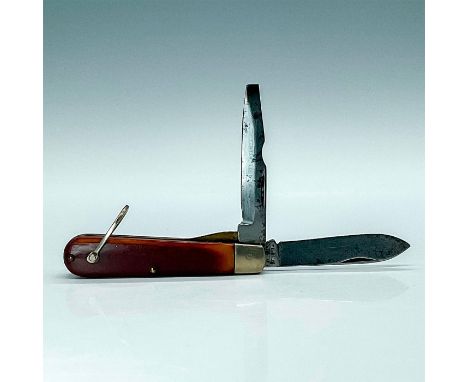 Attractive military lineman pocketknife with amber colored celluloid looking scales. Comes with two blades, has screwdriver e