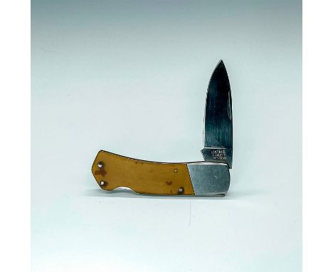 Blade is made of stainless steel and measures 3""L. This item has a lockback and tan compoSight handles. Issued: 20th Century