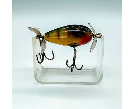 Charming little lure in Perch Scale, front and rear propellers, reinforced double hooks, and glass eyes. Dimensions: 2"LManuf