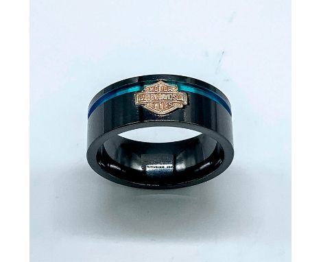 Black titanium band with a silver tone Harley Davidson logo and thin rainbow stripe around the top. Size 13.75. Condition: Ag