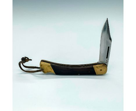 Sturdy folding knife with German cutlery steel blade measuring 3.5""L. Jacaranda Wood scales with brass bolsters and lanyard 