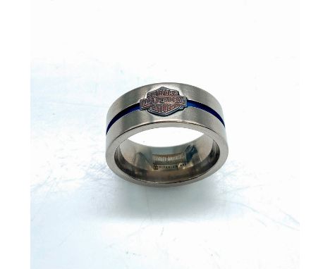 Titanium band with carved blue center stripe and Harley Davidson logo. Size 11.5. Condition: Age related wear.