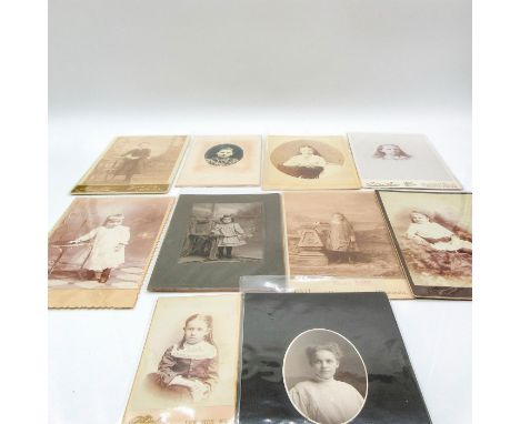 Featuring thick cardstock photographic material and plastic sheet covering on all photos. Depicts portrait photos of female i