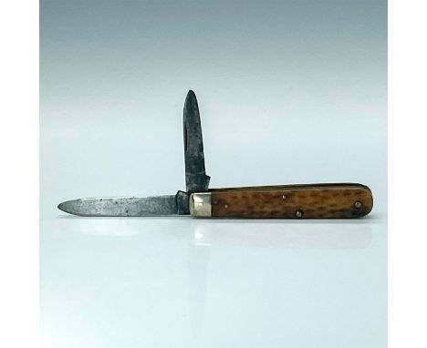 Attractive small pocketknife with horn like scales, brass liner, and steel blade. Longest blade measures 2.5"L. Issued: 1932-