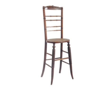A Victorian 19th century oak wood&nbsp;musician harpist chair stool. The chair having a carved fan shaped top slat over a tur