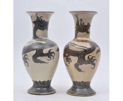 A pair of 19th century Song Dynasty style Cizhou ware white slip glazed ceramic terracotta vases. The pair of vases having a 