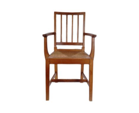 Megan Lloyd George (First Female MP For A Welsh Constituency) - a 20th century carved oak stick back armchair with rattan wea