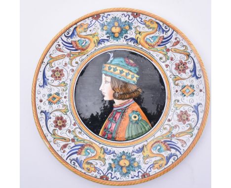 A late 20th century Italian majolica plate / charger. The charger with side profile portrait of a young Renaissance style boy