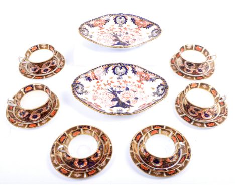 Royal Crown Derby - A collection of 20th century Imari pattern porcelain comprising six cups, saucers and plates (trio's) alo