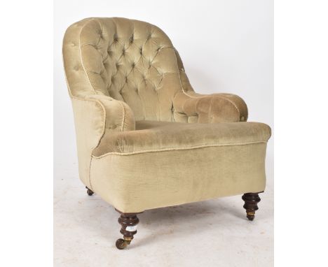 A 19th century Victorian tub armchair in the manner of&nbsp;Cornelius V Smith. The chair with button back rest and scrolling 