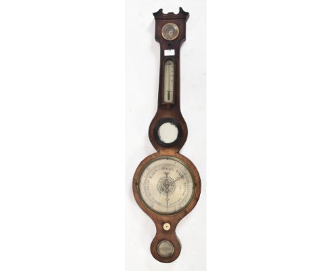 A George III early 19th century walnut banjo wall barometer. The barometer having a scrolled pediment atop over a brass bound