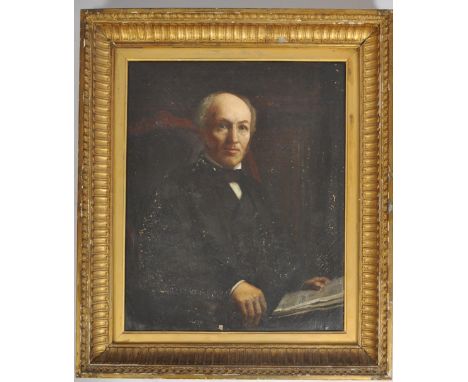 A late 19th century Victorian portrait depicting a seated noble gentleman reading. Presented in a gesso and gilt wood cassett