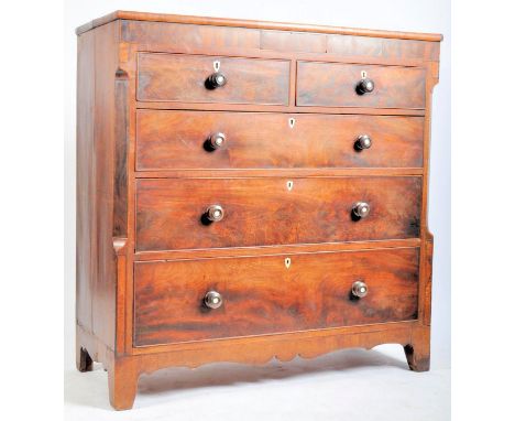 A 19th century Victorian flame mahogany Scottish large chest of drawers. The chest being raised on bracket feet with short ov