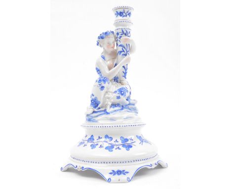 An early 20th century Continental porcelain fine bone china figurative candle holder statuette in the manner of Royal Copenha