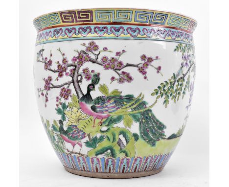 An early 20th century Chinese Oriental Republic ceramic famille rose floor planter / vase. The planter having a circular flar