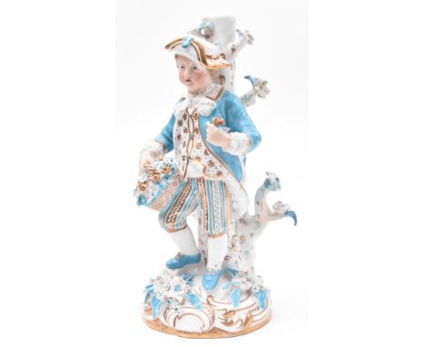 An early 19th century Continental German fine bone china boy figurine / statuette. The figure of boy with hat &amp; flower ba