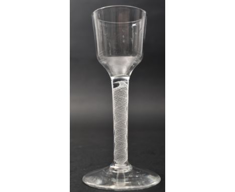 A George III mid 18th century circa 1760s crystal opaque single twist cordial glass. The glass having an ogee bowl over a whi