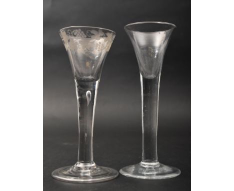 A pair of George III 18th century circa 1770s crystal tall stem wine / cordial glasses. The lot comprising of a tall plain st