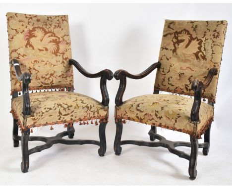 A pair of 19th century French Louis XIV oak framed tapestry upholstered fireside high back armchairs / chairs. Each arm chair