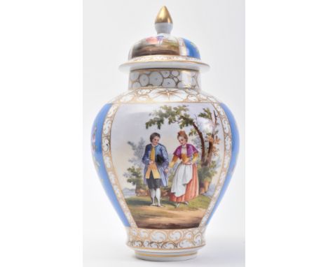An early 19th century Continental German Meissen porcelain hand painted lidded vase.&nbsp;The vase having a shaped finial lid