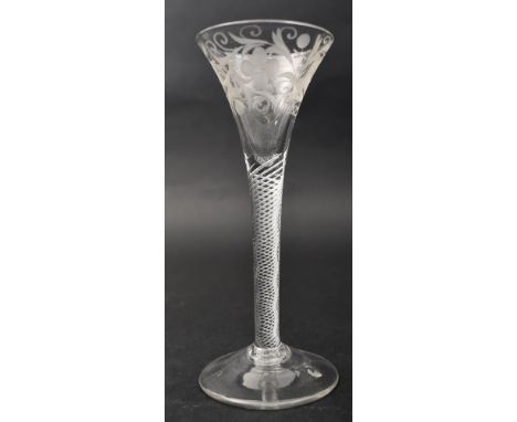 A Jacobites mid 18th century engraved crystal air-twist stem wine glass. Etched trumpet bowl with rose engravings &amp; flowe