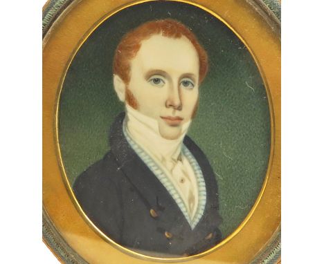 λ English School 19th century Portrait miniature of a gentleman, head and shoulders in a blue coat and striped waistcoat Oval