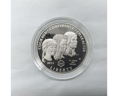 West Point Mint. A commemorative issue coin celebrating the centennial of the US Girl Scouts. The obverse side depicts three 