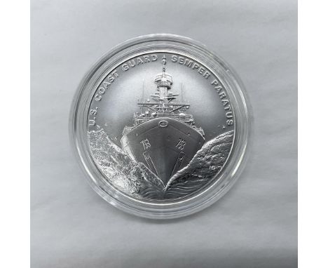 The obverse side depicts a Coast Guard national security cutter. The reverse side features the two iconic symbols of the Coas