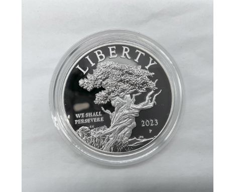 Philadelphia Mint. The obverse side depicts a bristlecone pine tree, believe to be the oldest organism on Earth. The reverse 