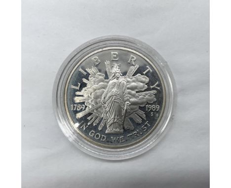 San Francisco Mint. Proclaiming the Triumph of Democracy. The obverse side depicts the Statue of Freedom. The reverse side de