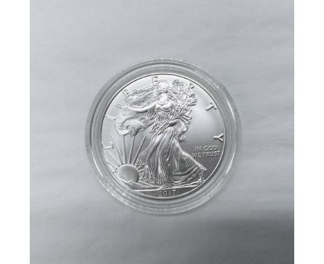 West Point Mint. The obverse side features full length of Liberty in stride. She is shown wrapped in the folds of the flag of