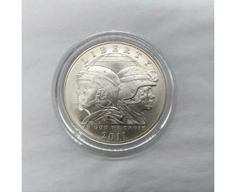 San Francisco Mint. The obverse side depicts a male and female soldier positioned back to back. The reverse side features the