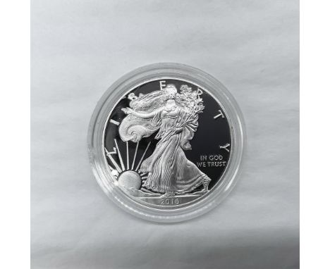 West Point Mint. The obverse side features full length of Liberty in stride. She is shown wrapped in the folds of the flag of