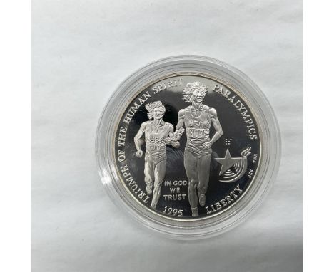 Philadelphia Mint. A commemorative coin celebrating the Atlanta Olympics, Paralympics Centennial. The obverse side depicts a 