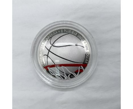 Philadelphia Mint. The obverse side depicts a basketball about to pass through the net. The reverse side features a basketbal