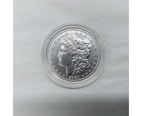 Denver Mint. The obverse side features Liberty in profile. She is shown in cap, flora, and crown. The reverse side depicts an