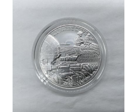 The obverse side features three Marines with M4 rifles moving ashore. The reverse side depicts the Marine Corps Eagle, Globe,