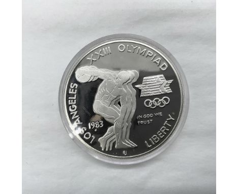 San Francisco Mint. The obverse side depicts a discus thrower. The design is inspired by the Greek sculptor, Myron. The rever