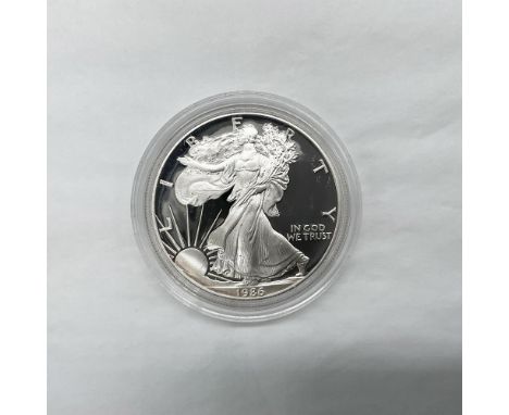 San Francisco Mint. The obverse side features full length of Liberty in stride. She is shown wrapped in the folds of the flag