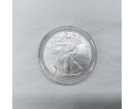 West Point Mint. The obverse side features full length of Liberty in stride. She is shown wrapped in the folds of the flag of